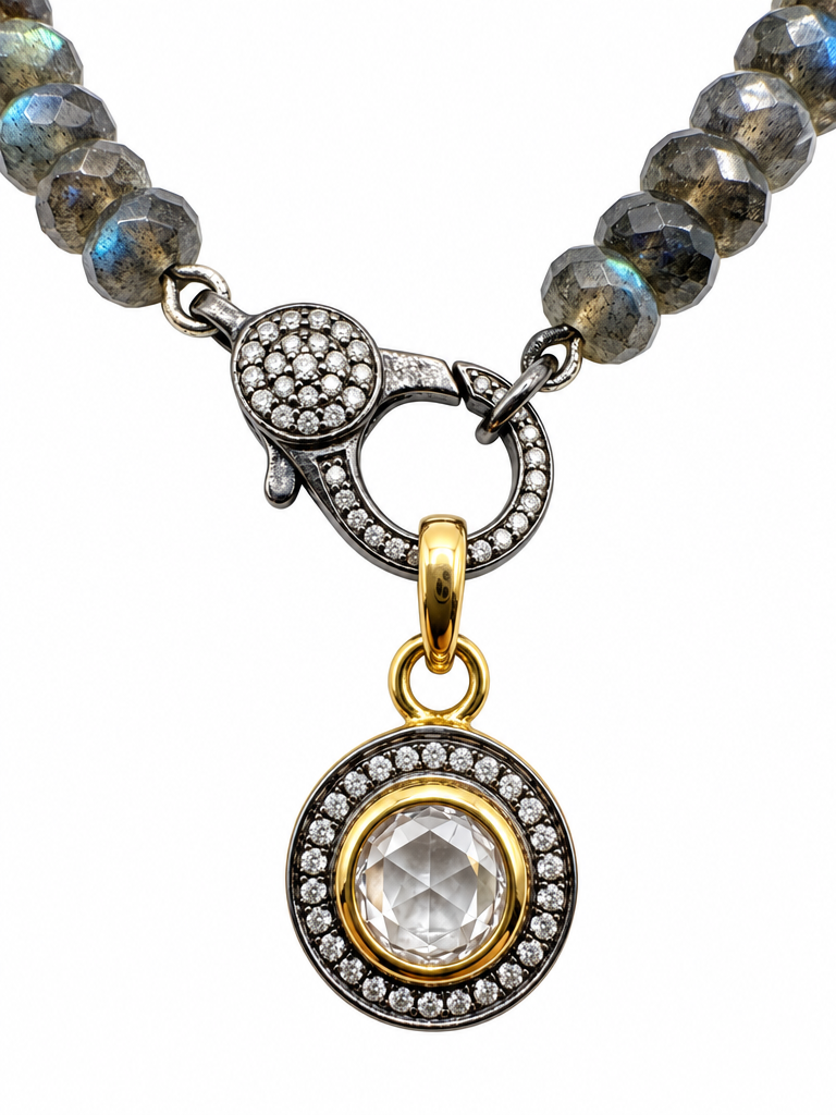 Close-up of the pave diamond clasp and diamond pendant on the Modern Round Labradorite Necklace