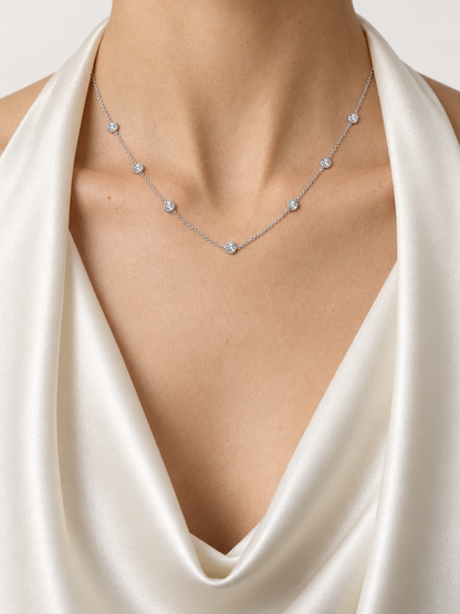 Close-up of the Reserve Diamond Station Necklace showing seven bezel-set diamonds along a fine 14K white gold chain
