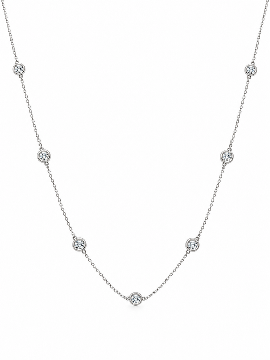 The Reserve Diamond Station Necklace laid flat, showing the full 14K white gold chain and diamond stations