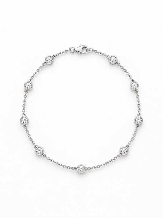 Reserve Diamond Station Bracelet in 14K white gold, bezel-set diamonds spaced along a fine cable chain with a lobster clasp