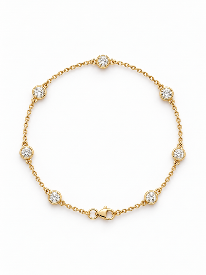 Reserve Diamond Station Bracelet in 14K yellow gold, bezel-set diamonds spaced along a fine cable chain with a lobster clasp