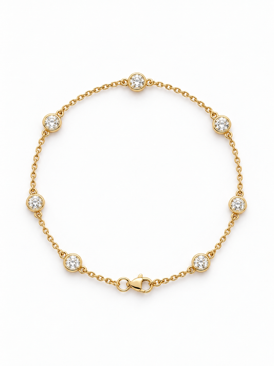 Reserve Diamond Station Bracelet in 14K yellow gold, bezel-set diamonds spaced along a fine cable chain with a lobster clasp